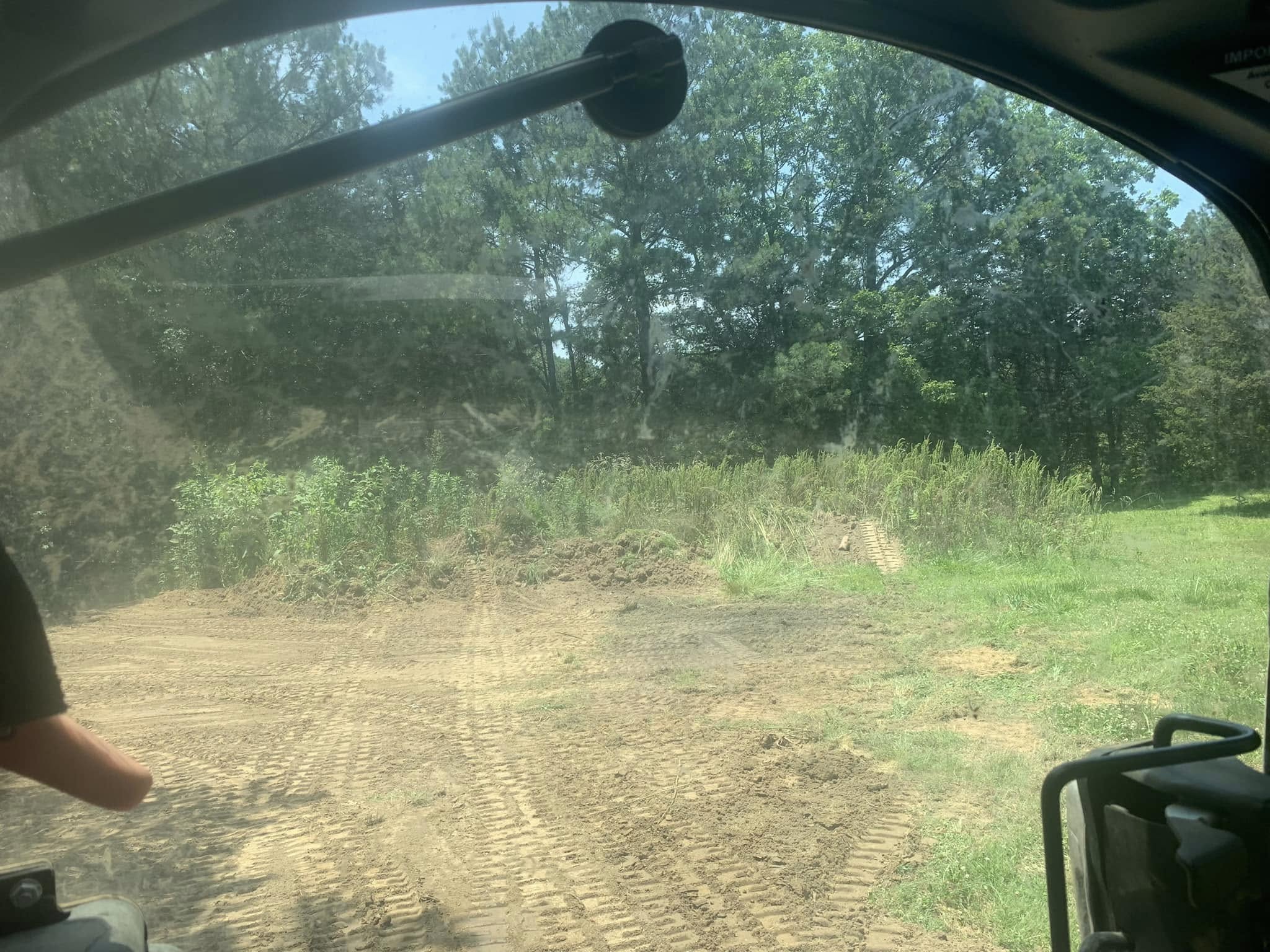 Grading and leveling a driveway for proper drainage in Cullman County Grading and leveling a driveway for proper drainage in Cullman County