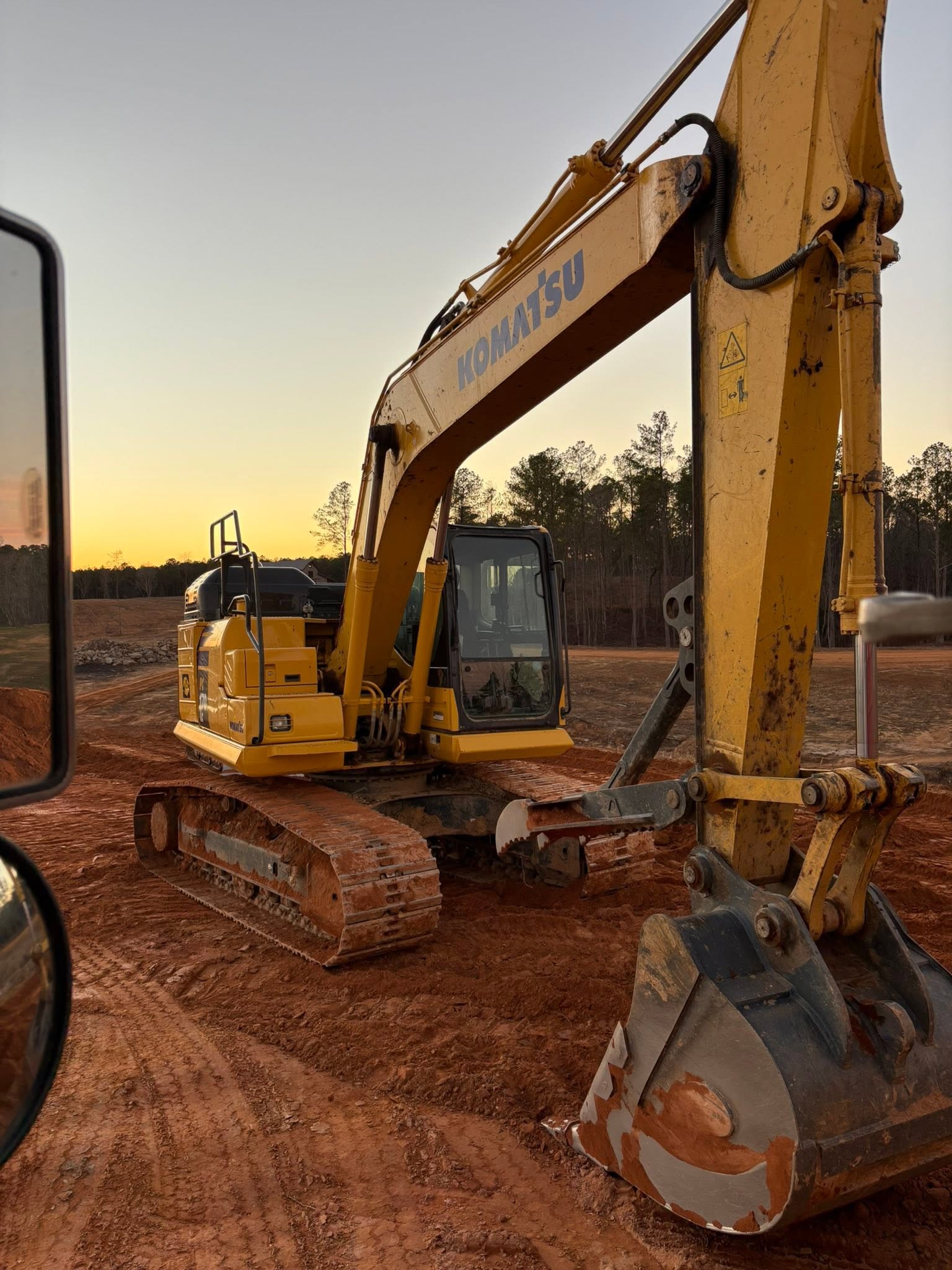 Family-owned C&H Hauling and Excavating operating an excavator in Bremen, AL Family-owned C&H Hauling and Excavating operating an excavator in Bremen, AL